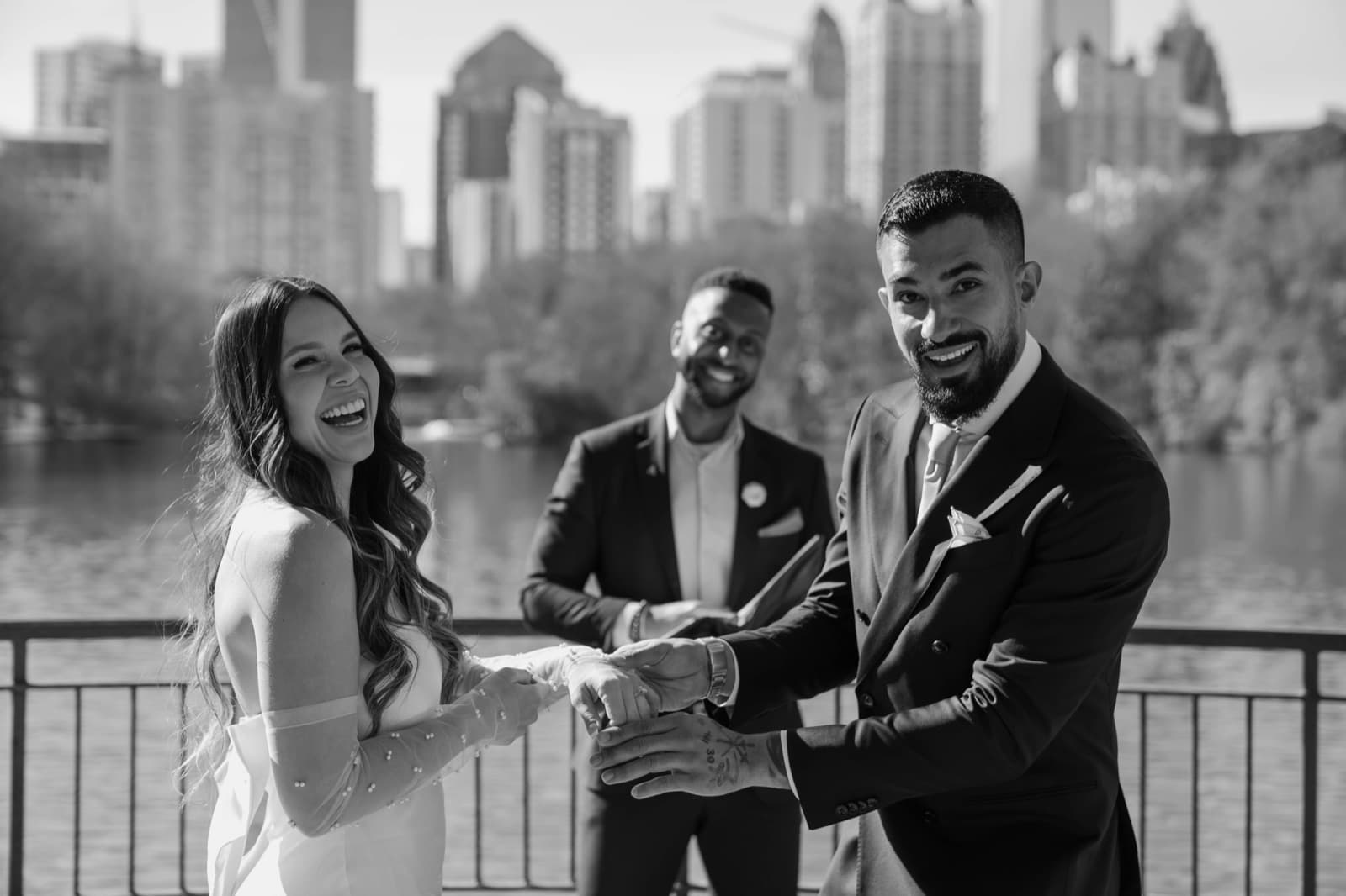 Elopement ceremony at Piedmont Park with the Atlanta skyline, officiated by Weddings by Tré